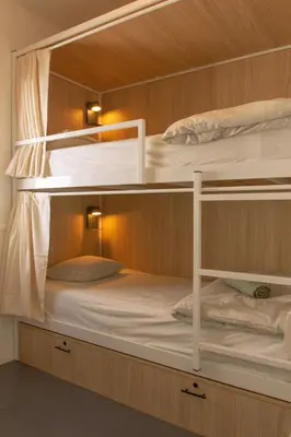 a bunk bed with two bunk beds in a room at The Lighthouse Hostel in Sagres