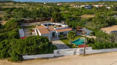 an aerial view of a house with a swimming pool at The Lighthouse Hostel in Sagres