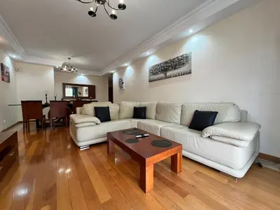 a living room with a white couch and a table at Agustin's House in Funchal