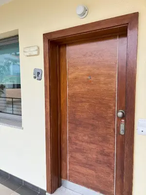 a wooden door on the side of a building at Agustin's House in Funchal