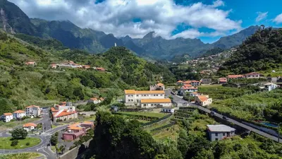 a small town in a valley with mountains at Amarelo Apartment by Atlantic Holiday in São Vicente
