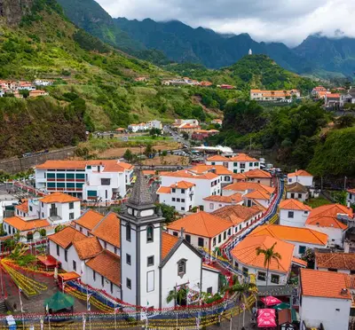 an aerial view of a town with a mountain at Amarelo Apartment by Atlantic Holiday in São Vicente