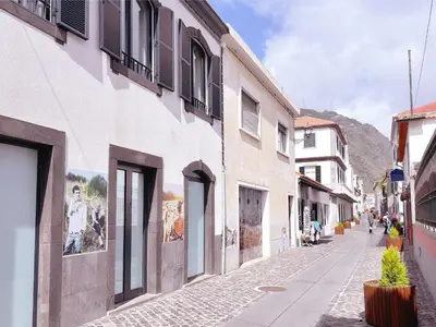 a street in a town with a building at Angela`s Loft in Ribeira Brava