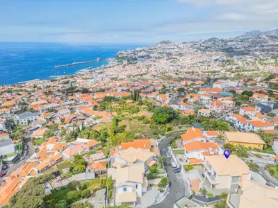 an aerial view of a city with orange roofs at Villa Funchal bay view in Funchal