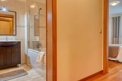 a bathroom with a shower and a sink at Baia Machico, a Home in Madeira in Machico