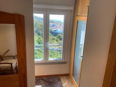 a room with a window with a view at Moniz Apartment in Caniço