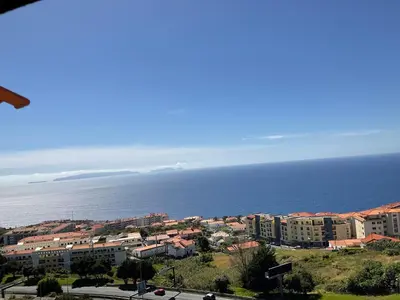 a view of a city and the ocean at Moniz Apartment in Caniço