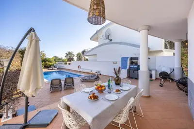 an aerial view of a resort with the ocean at Burgau Sea View, Beach & Pool Villa in Budens