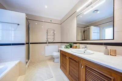 a bathroom with a sink and a mirror at Burgau Sea View, Beach & Pool Villa in Budens