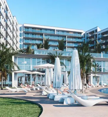 an apartment building with a swimming pool and palm trees at Madeira Residence Apt. 80 in Funchal