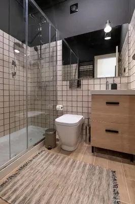 a bathroom with a toilet and a shower and a sink at Moonrise Flat in Aljezur