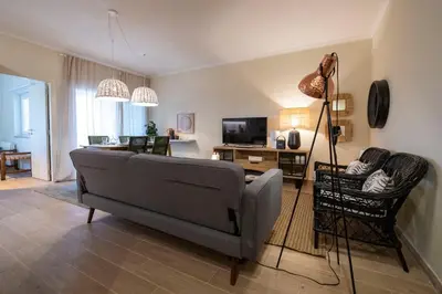 a living room with a couch and a table at Moonrise Flat in Aljezur