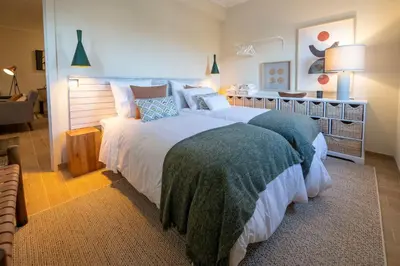 a bedroom with a large bed in a room at Moonrise Flat in Aljezur