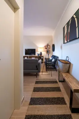 a living room with a couch and a table at Moonrise Flat in Aljezur