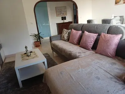 a living room with a couch and a table at Apartamento Maria in Canhas