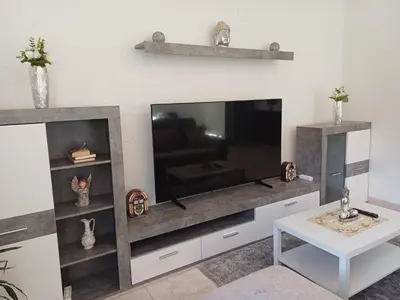 a living room with a large flat screen tv at Apartamento Maria in Canhas