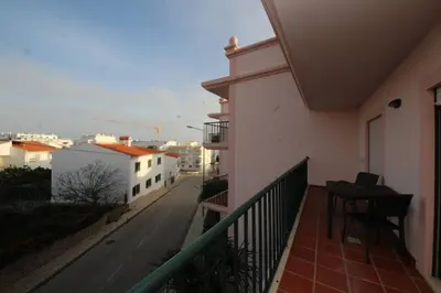 a balcony of a house with a view of a street at JM - St James, apart com WIFI, piscina a 50 mt da Praia in Lagos