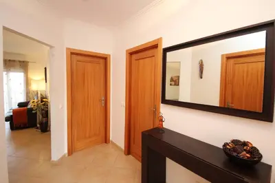 a living room with a large mirror on the wall at JM - St James, apart com WIFI, piscina a 50 mt da Praia in Lagos