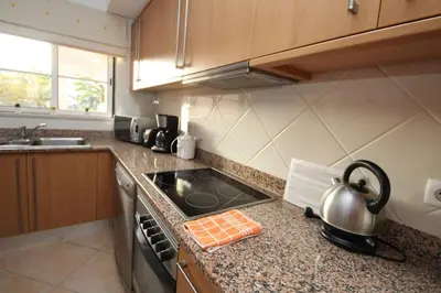 a kitchen with a stove and a pot on the counter at JM - St James, apart com WIFI, piscina a 50 mt da Praia in Lagos