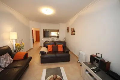 a living room with a couch and a table at JM - St James, apart com WIFI, piscina a 50 mt da Praia in Lagos