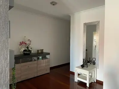 a shower with a glass door in a bathroom at Por do Sol in Caniço