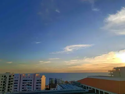 a view of the ocean at sunset from a building at Sea View Apartment in Funchal