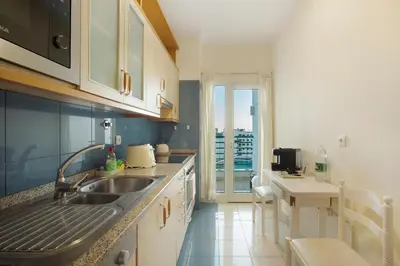 a kitchen with a sink and a counter top at Sea View Apartment in Funchal