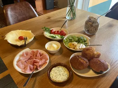 a wooden table topped with bowls of different types of food at Casa Vida Alegre in Prazeres
