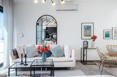 a living room with a white couch and a table at GuestReady - Anakaj House in Funchal