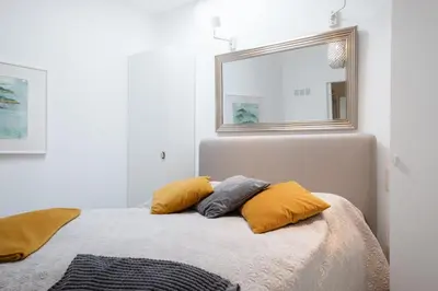 a bedroom with a bed with two pillows on it at GuestReady - Anakaj House in Funchal