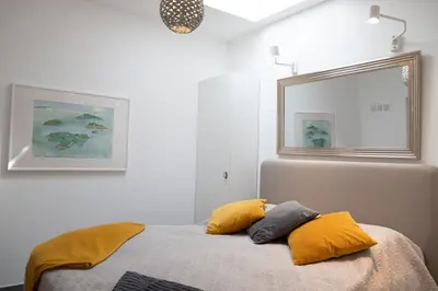 a bedroom with a bed with two pillows on it at GuestReady - Anakaj House in Funchal