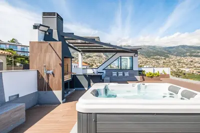 a hot tub on the roof of a house at Belle Maison by Homie in Funchal