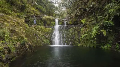 a waterfall in the middle of a pool of water at Studios by Aqua Natura Hotels in Porto Moniz