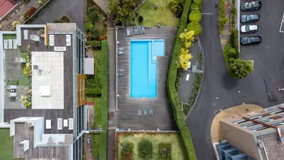 an overhead view of a house with a swimming pool at Funchal Frui Vita by Atlantic Holiday in Funchal