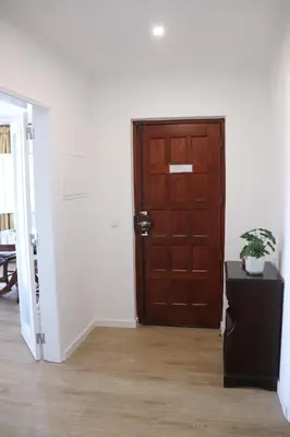 a room with a wooden door and a table with a plant at Luxury Villa with ocean view in Luz