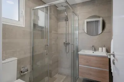 a bathroom with a shower and a sink at Barreiros III by An Island Apart in Funchal