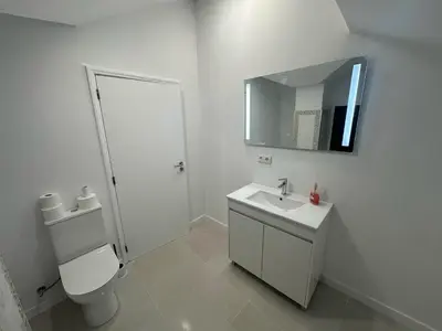 a bathroom with a toilet and a sink and a mirror at Funchal-Studio-Sleeps4-FreeParking in Funchal