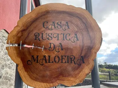 a wooden sign that reads casa rustica de madrid at Casa Rustica da Maloeira in Fajã da Ovelha