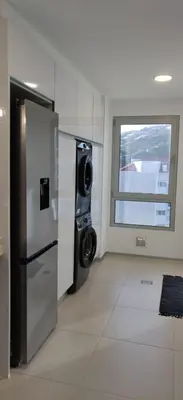 a kitchen with a refrigerator and a window at Formosa Ocean View - 142109/AL in Funchal