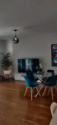 a living room with blue chairs and a table at Formosa Ocean View - 142109/AL in Funchal
