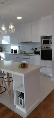 a kitchen with white cabinets and a white counter top at Formosa Ocean View - 142109/AL in Funchal