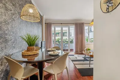 a dining room with a table and chairs at Catybel by Homie in Funchal