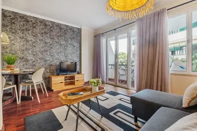 a living room with a couch and a table at Catybel by Homie in Funchal