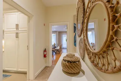 a hallway with a mirror and a table at The Suite QM in Funchal