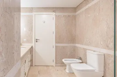 a bathroom with a toilet and a sink at The Suite QM in Funchal