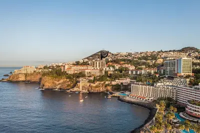 an aerial view of a city and the ocean at The Suite QM in Funchal