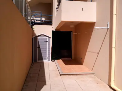 a hallway of a building with a garage at Bela Vista Capazi in Porto Santo
