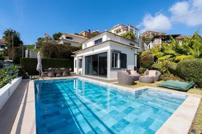 a swimming pool in the backyard of a house at Villa Liana by LovelyStay in Ponta do Sol