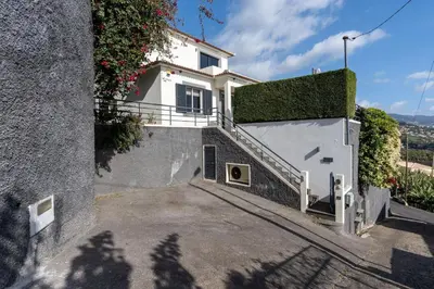 a white house with a staircase leading to a driveway at Villa Liana by LovelyStay in Ponta do Sol