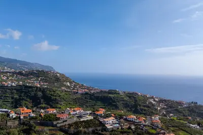 a town on a hill next to the ocean at Villa Liana by LovelyStay in Ponta do Sol